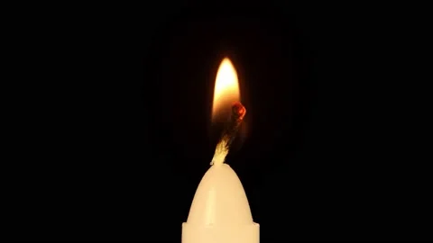 Macro ligniting candle Stock Footage 229427804