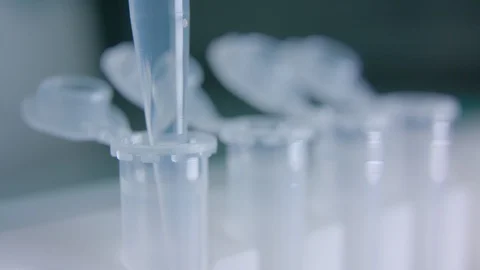 Macro Liquid dripped into test tubes Stock Footage 112214561