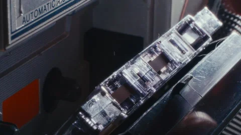 Macro of Loading Compact Audio Cassette into Vintage Tape Player 库存影片 342452707