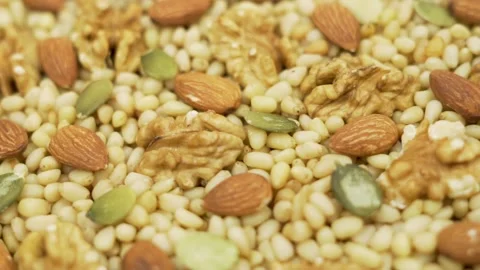 Macro a Lot Of Nuts Seeds, Almonds, Walnuts, Pine Nuts, Pumpkin Seeds, Rotate. I Stock Footage 165270269