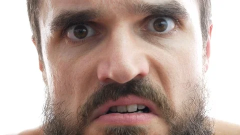 Macro of mad bearded man looking at you 库存影片 71611616