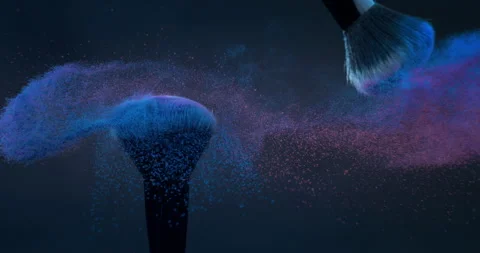 Macro of makeup brushes with flying cosmetic product powder particles splash Stock Footage 268980367