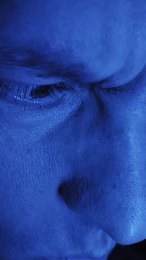 Macro Male Eye Blinking Under Intense Blue Light Stock Footage 326313231