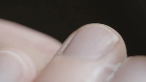 Macro Of A Man Applying Cream On His Thumb Abstract. 4K Vídeos de archivo 273378565