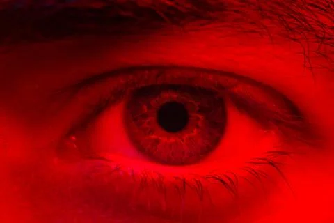 Macro on man eye expressing serious and expressionless expression