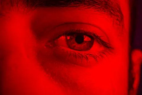 Macro on man eye expressing serious and expressionless expression Stock Photos