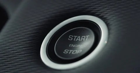 Macro of a Man's Finger Pushing the Button to Start his Vehicle's Engine Stock Footage 233160693