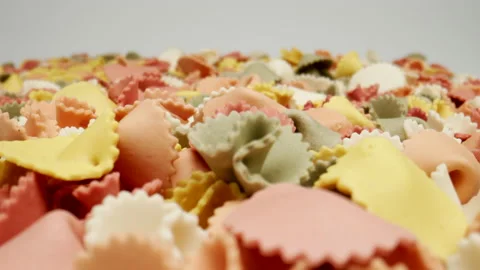 MACRO: Many colour figural pasta on a white background, Dolly shot Stock Footage 166028719