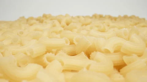 MACRO: Many pasta on a white background, Dolly shot Stock Footage 166028801