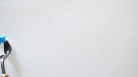 Macro. mastikhin, putty, brush on white paper or cloth, art. the artist paints  Stock Footage 129623262