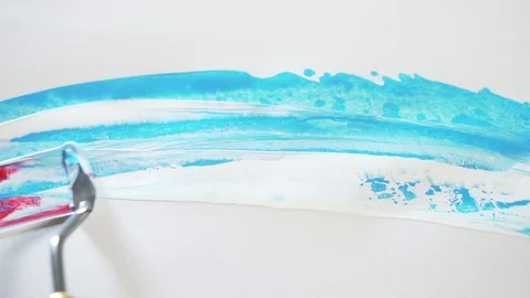 Macro. mastikhin, putty, brush on white paper or cloth, art. the artist paints Stock Footage 129623335