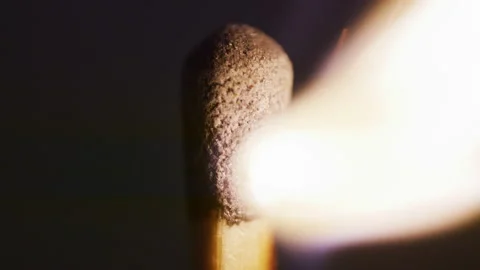 Macro match light on black Stock Footage 132482648