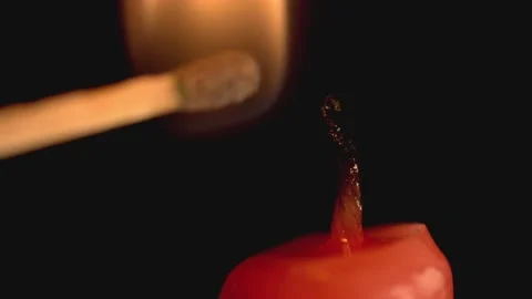 Macro Of A Match Lighting A Candle close-up Stock Footage 234241816