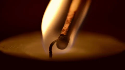 Macro of a match lighting a candle Stock-Footage 48268622