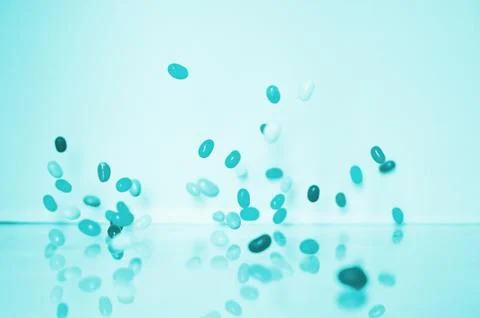 Macro of medicine falling Stock Photos