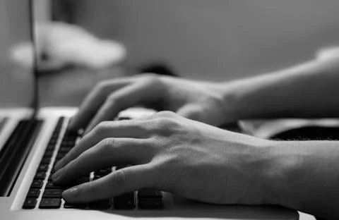 Macro, men hand typing on notebook keyboard  Stock Photos
