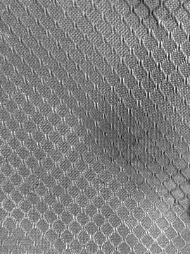 Macro metal texture with silver raised dots pattern Stock Photos