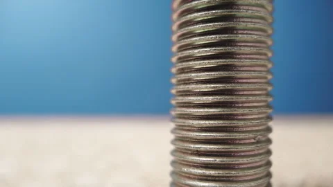 Macro of a metallic screw over a white background. Stock Footage 255646229