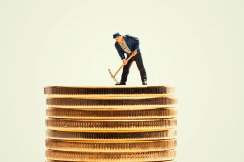 Macro miner figurine on bitcoin stack. cryptocurrency concept Stock-Fotos