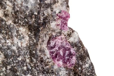 Macro of a mineral Ruby stone on a white background Stock Photos