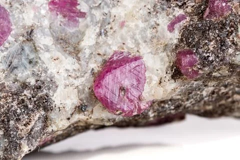 Macro of a mineral Ruby stone on a white background 스톡 사진