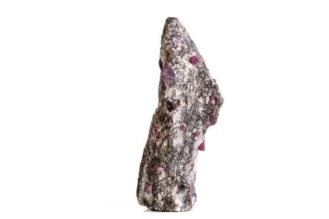 Macro of a mineral Ruby stone on a white background Stock Photos