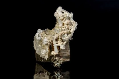 Macro mineral stone Pyrite in quartz on a black background Stock Photos