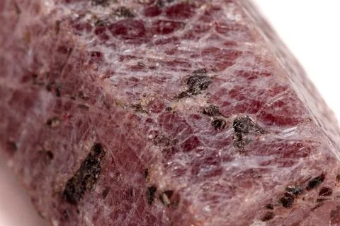 Macro mineral stone Ruby in the breed a white background Stock Photos