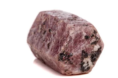 Macro mineral stone Ruby in the breed a white background Stock Photos