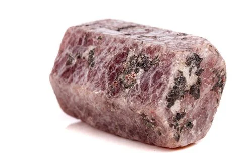 Macro mineral stone Ruby in the breed a white background Stock Photos