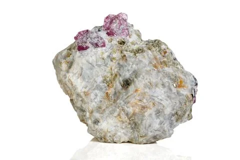 Macro mineral stone Ruby in rock on white background Stock Photos