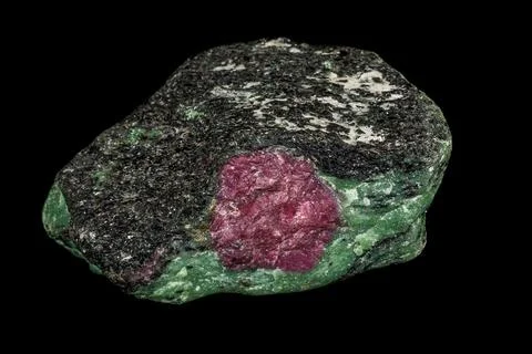 Macro of mineral stone ruby in rock on black background 写真素材
