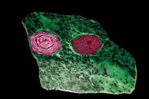 Macro of mineral stone ruby in rock on black background 写真素材