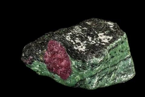 Macro of mineral stone ruby in rock on black background 스톡 사진