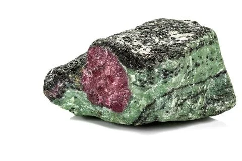 Macro of mineral stone ruby in rock on white background Stock Photos