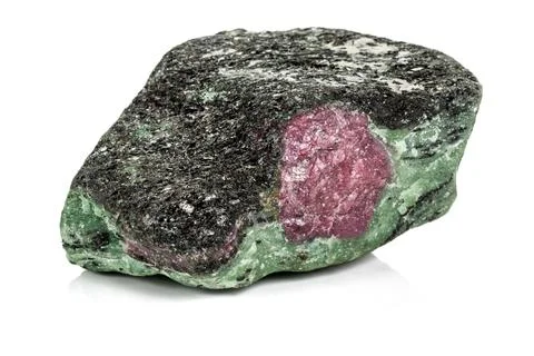 Macro of mineral stone ruby in rock on white background Stock Photos