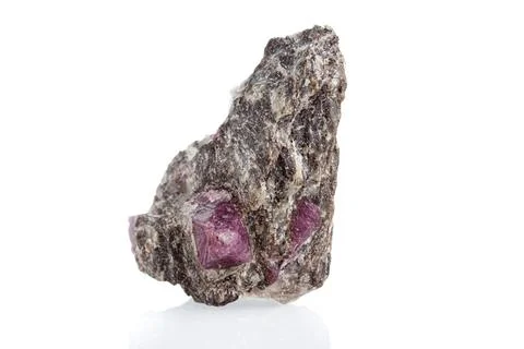 Macro mineral stone ruby on a white background Stockfoto's