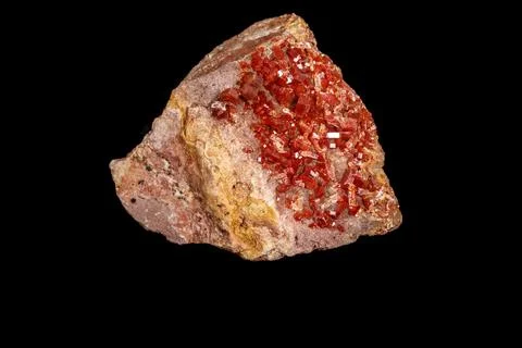 Macro mineral stone Vanadinite on a black background Stock Photos