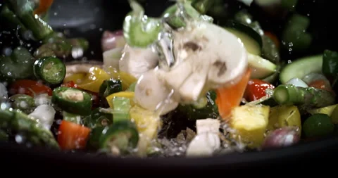 Macro of mixed vegetables and mushrooms champignon fall with oil drops on pan Stock Footage 268992089
