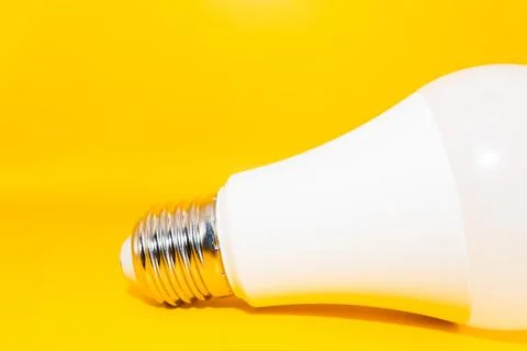 Macro Modern LED lamp, saving electricity. Tungsten light bulb lamp close-up. Stock Photos