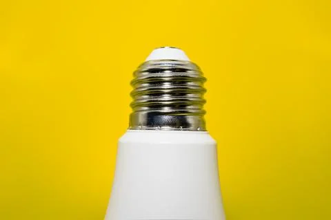Macro Modern LED lamp, saving electricity. Tungsten light bulb lamp close-up. Stock Photos