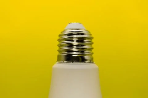 Macro Modern LED lamp, saving electricity. Tungsten light bulb lamp close-up. Stock Photos