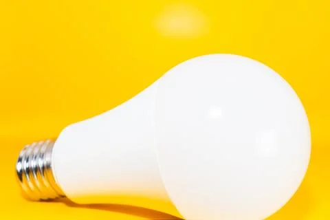 Macro Modern LED lamp, saving electricity. Tungsten light bulb lamp close-up. Stock Photos