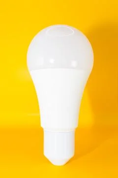 Macro Modern LED lamp, saving electricity. Tungsten light bulb lamp close-up. Stock Photos