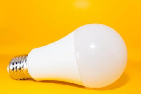 Macro Modern LED lamp, saving electricity. Tungsten light bulb lamp close-up. Фото