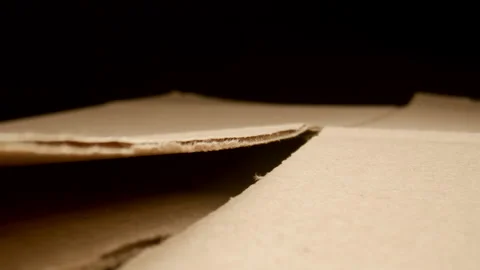 MACRO: Motion along a disassembled cardboard box Stock Footage 181800829