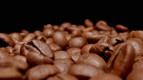 MACRO: Motion over coffee beans on a black background Stock Footage 144417510