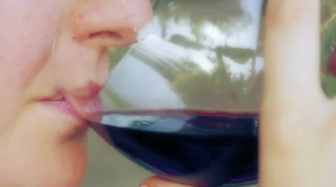 Macro of the mouth of a sommelier drinking red wine Stock Footage 28498449