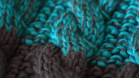 Macro with movement of blue and brown knitted fabric, extreme close up of cloth Stock Footage 244688160