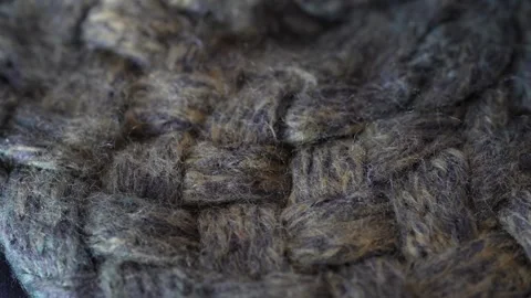Macro with movement of grey and green knitted fabric, extreme close up of cloth Stock Footage 244688275